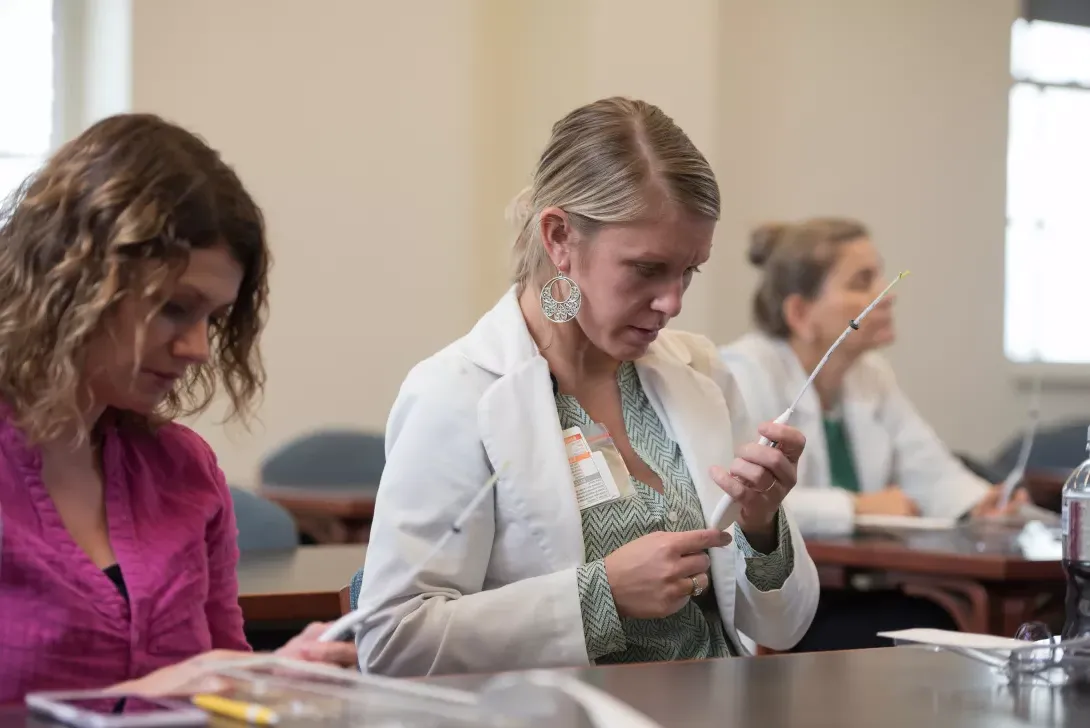 Nursing students learning to use equipment